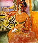 a woman sitting before the window.